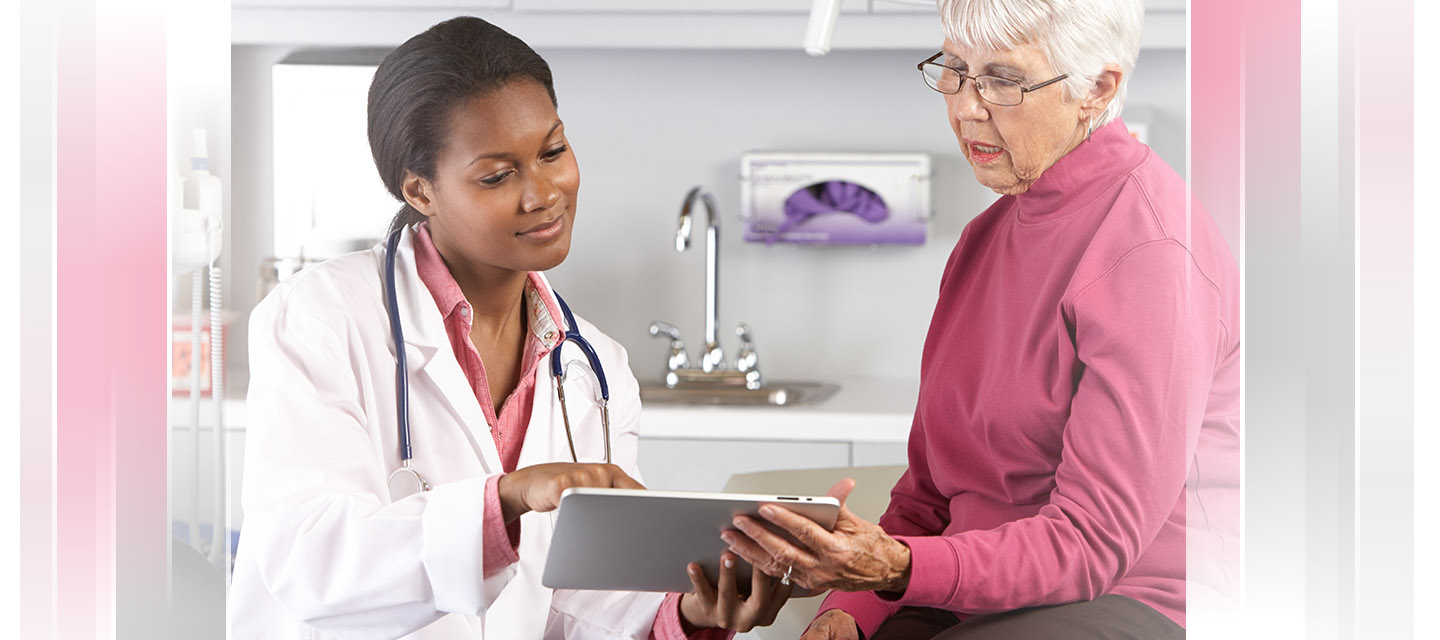 physician showing patient her results on a mobile tablet