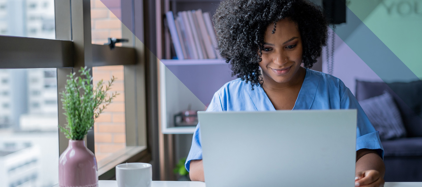 Nurse using a laptop to look up new website