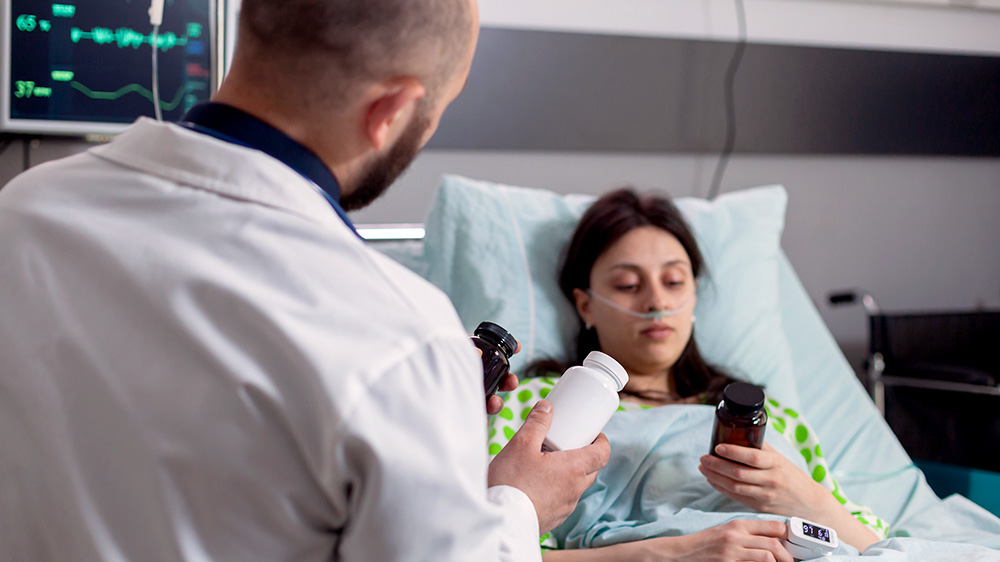 Clinician administering medicine to patient