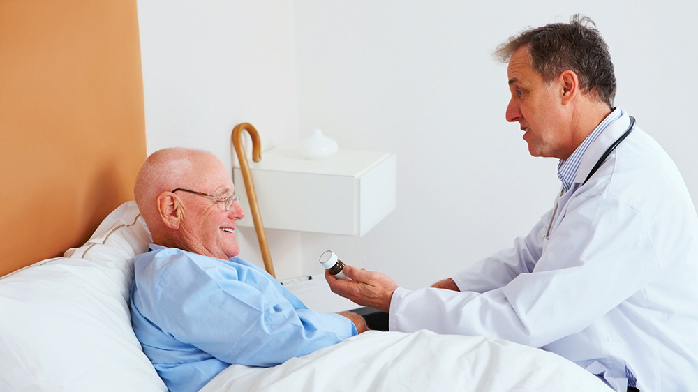 Clinician administering medicine to patient