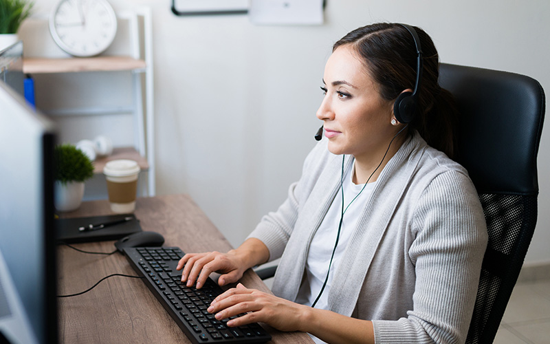 Administrative worker typing on keyboard