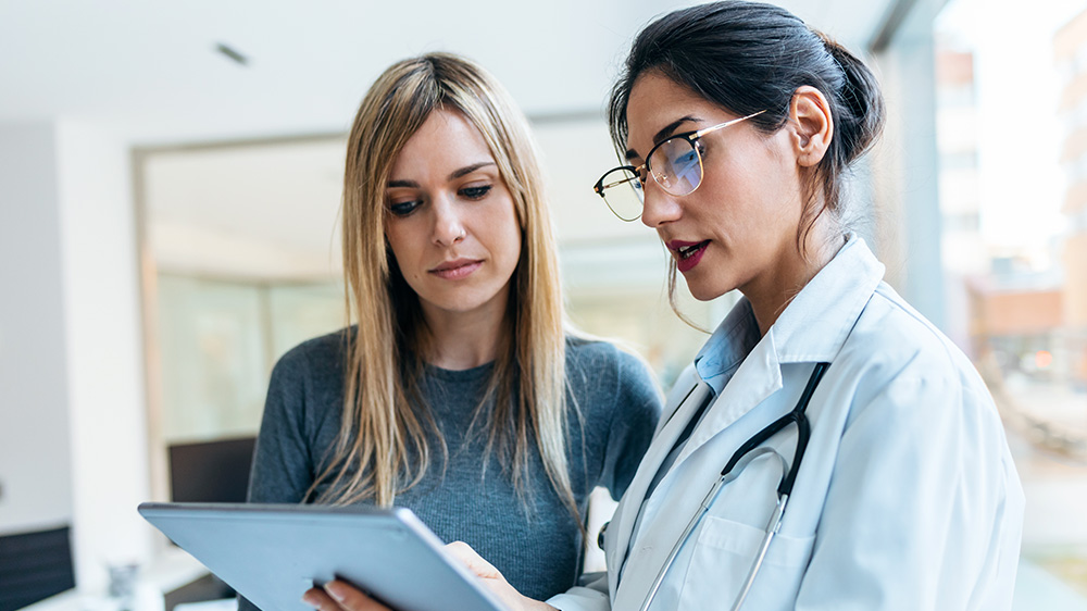 Doctor and patient reviewing records