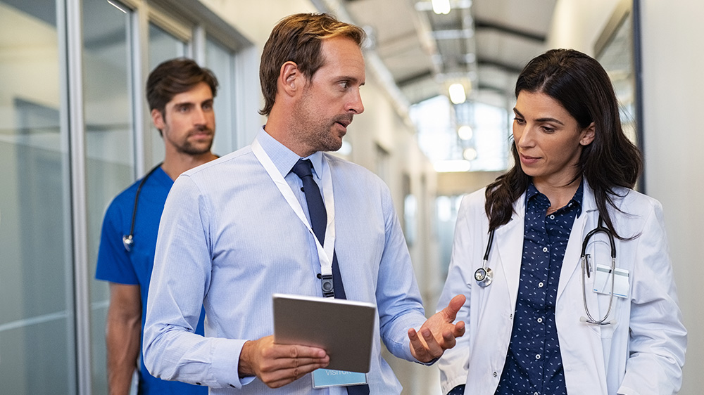 Doctor talking with consultant