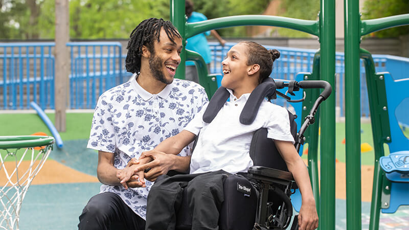 Disabled patient playing on playground