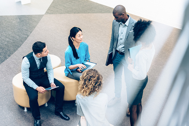 Multiracial business team meeting in lobby