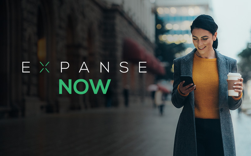 Woman checking Expanse Now on mobile device