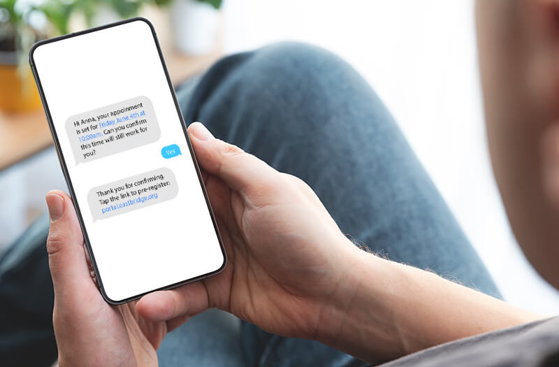 Man holding smart phone with Expanse Patient Connect
