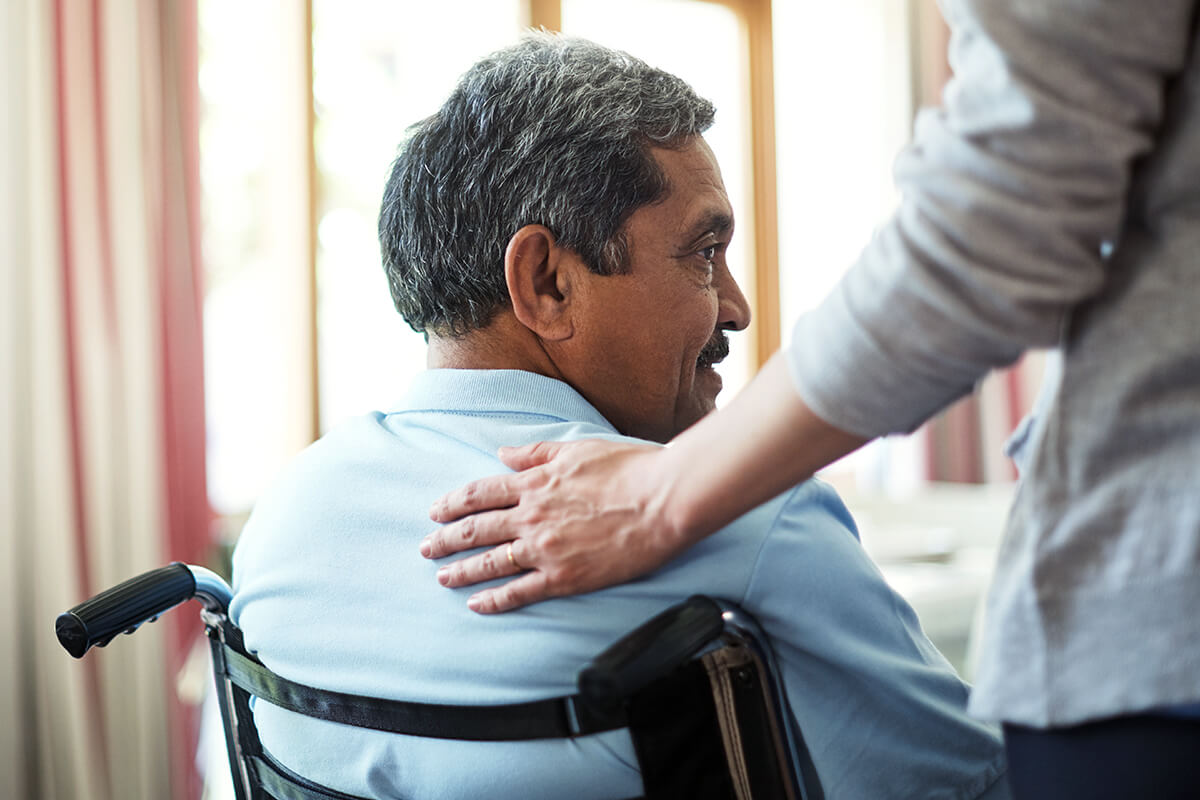 Female nurse assisting elderly patient