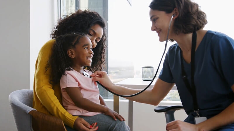 Video Thumbnail of a physician using a stethescope on a young patient