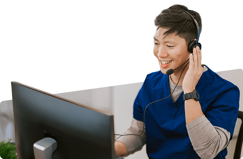 hospital receptionist talking to patient at registration counter