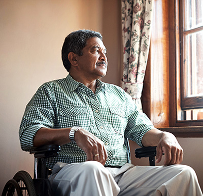 Richard's head shot - Elderly man in wheelchair looking out window