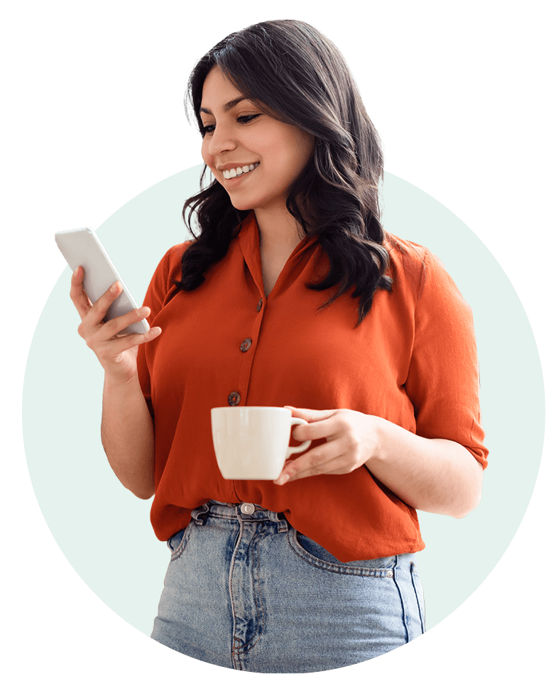 happy young adult woman using smartphone