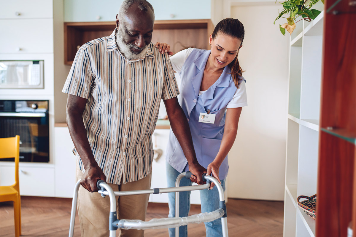 Female nurse assisting elderly patient