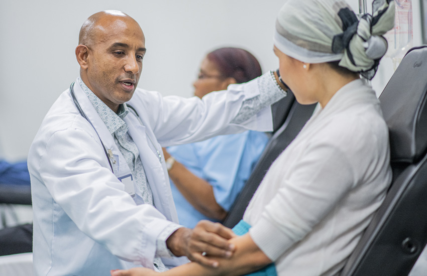 Dr speaking with oncology patient