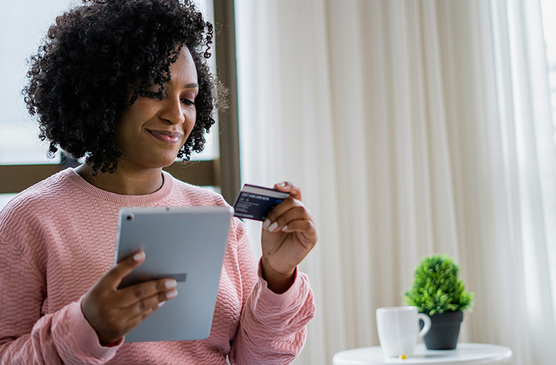 Happy patient making online payment from home