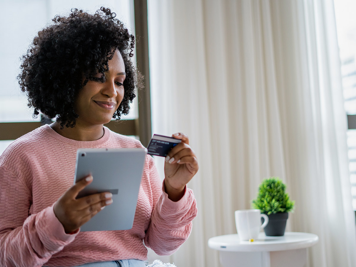 Happy patient making online payment from home