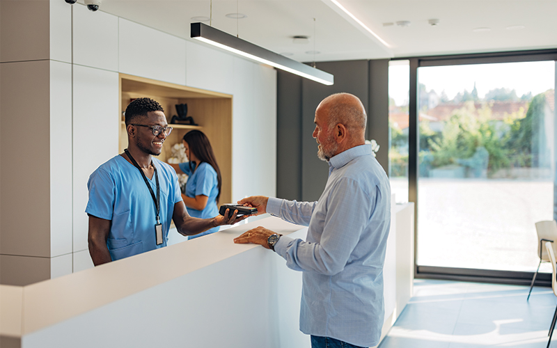 Young woman of color checking her phone at home