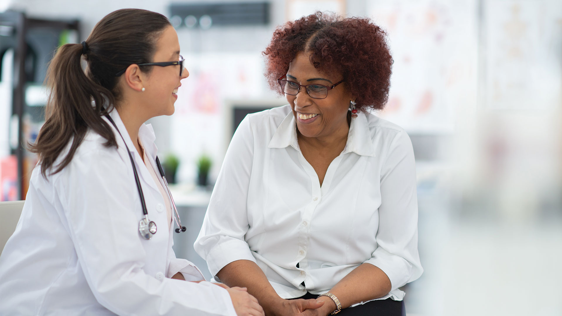 Doctor using Ambient Listening with patient