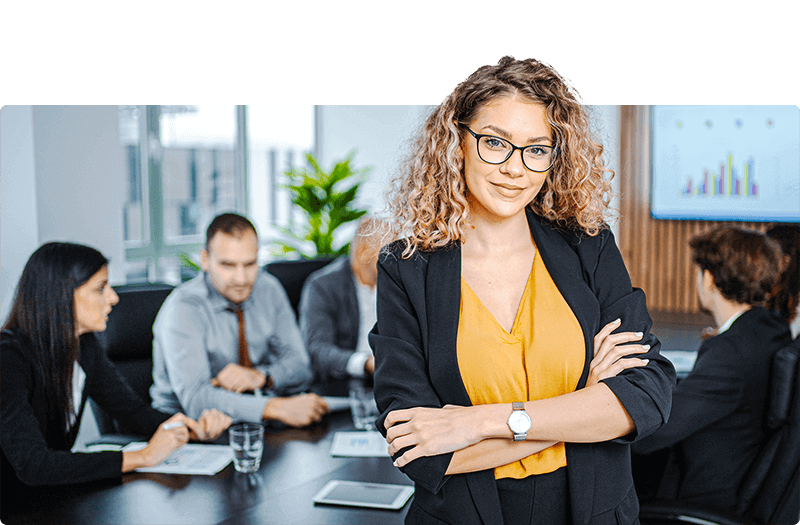 Business woman standing confidently in front of meeting