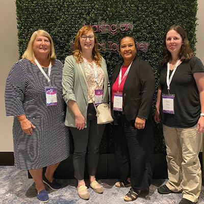 MEDITECH Women In Tech members smiling at an event