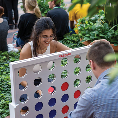 MEDITECHERs having fun playing connect four at an event