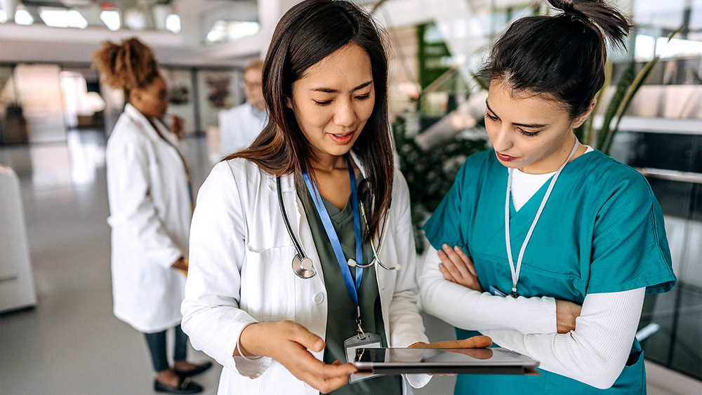 Physician using a tablet in a hospital setting