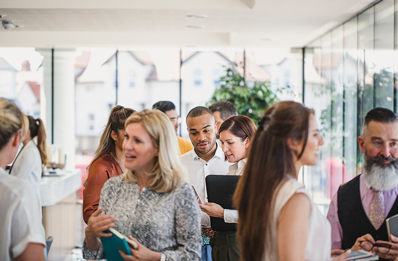 Group of businesspeople networking at a conference