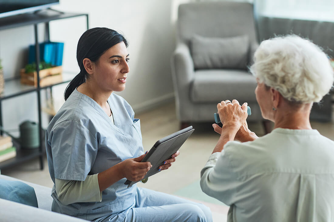 Nurse working with elderly patient