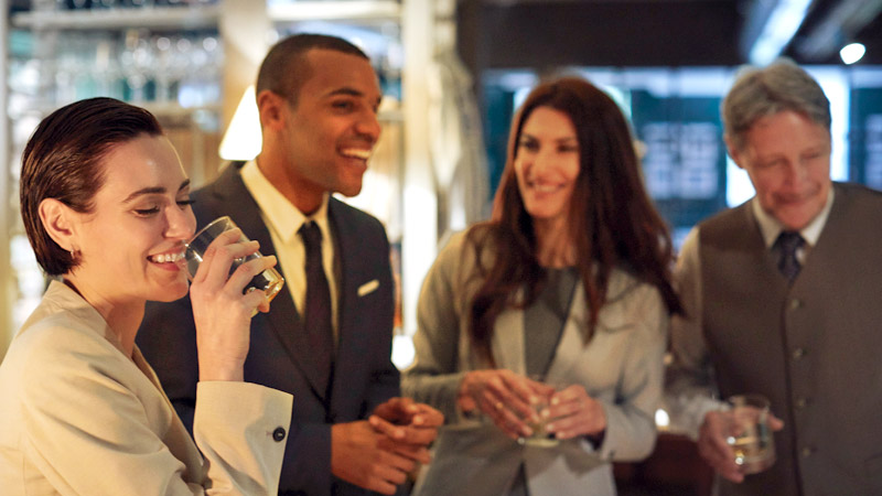 Group of business people gathered at a restaurant