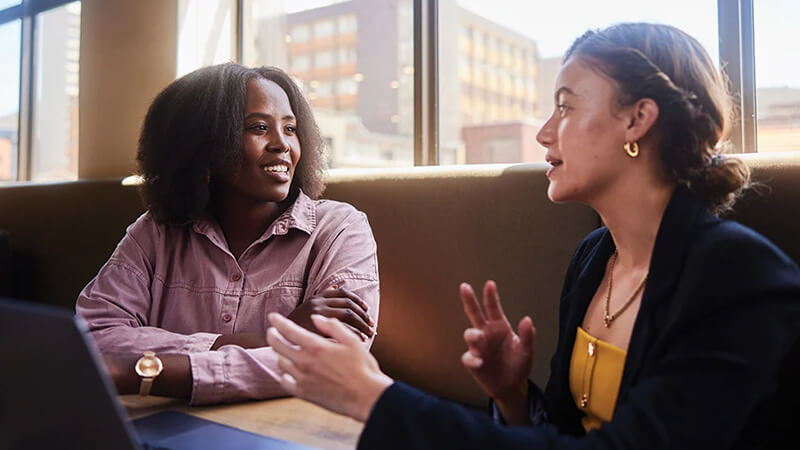Two business professionals having a discussion