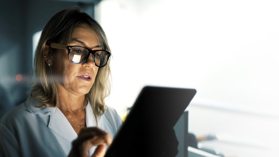 Female doctor using tablet